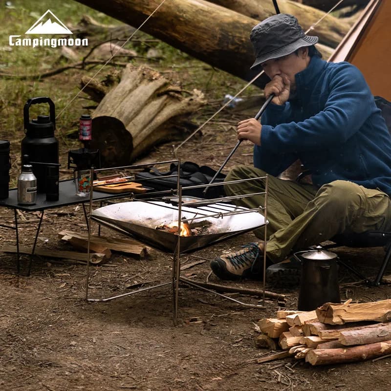 طاولة نار محمولة من الفولاذ المقاوم للصدأ من CAMPINGMOON SOLO-A3 مع جسور قابلة للتعديل وشواية تخييم قابلة للطي للطهي في الهواء الطلق